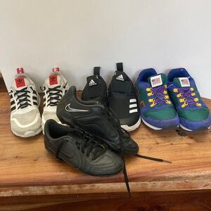 Three Pairs of kids Sneakers one pair Cleats 
Size 2 1/2  KIdS